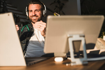 Smiling freelancer gesturing and talking on video call