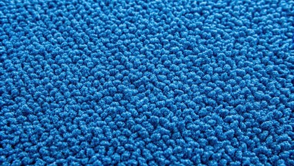 Vibrant blue carpet background with intricate texture and subtle sheen, forming a stunning and modern wallpaper design perfect for commercial or residential spaces.