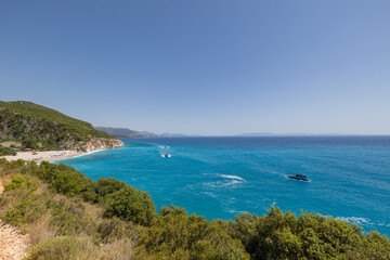 Speed boats on the Ionian Sea seen from the pathway leading to Gjipe Beach near Dhermi along the southern coast of Albania
