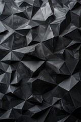 Fototapeta premium A close-up shot of a black wall covered with colorful paper triangles
