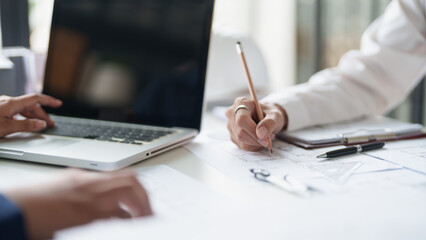 Fototapeta premium Architecture drawing on architectural project business architecture building construction Colleagues designer Planning Design on blueprint and compasses