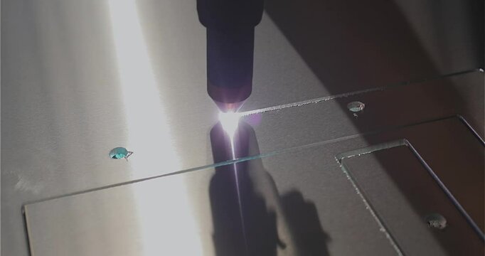 The work of a plasma cutter close-up. A plasma cutter cuts a detail, close-up. The work of the CNC plasma cutter