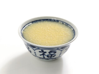 A bowl of nutritious breakfast millet porridge on the white table