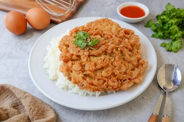 Thai style Rice with omelet stuff minced pork ,street food of thailand ,Thai call khao kai jeaw moo sab , Top view table	