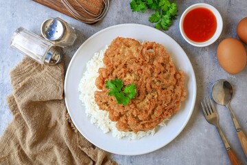 Thai style Rice with omelet stuff minced pork ,street food of thailand ,Thai call khao kai jeaw moo sab , Top view table	