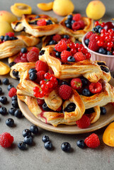 Homemade puff pastry pies with fruit