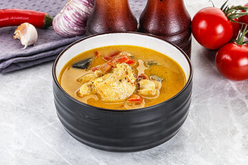 Traditional yellow Thai curry with chicken
