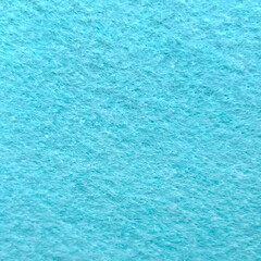 Texture of a synthetic turquoise  kitchen rag close up