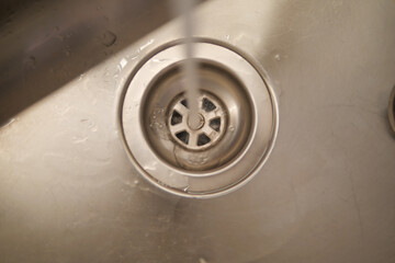 water pouring from a faucet tap slow motion 