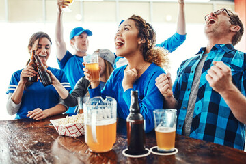 Sports, men and women in pub with celebration, solidarity and win with beer at broadcast of world...