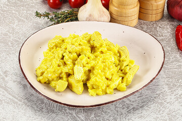 Italian cuisine - yellow risotto with chicken