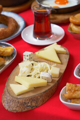 Enjoy a breakfast spread featuring tea and a selection of cheeses for a delicious start to your day