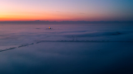 The golden island. Grado Island from above at sunset.