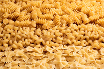 Food background of raw pasta close up
