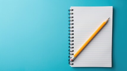 Desk with notepaper and pencil on blue background minimal design