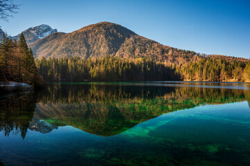 Morning in the Fusine lakes valley. Autumn reflections.