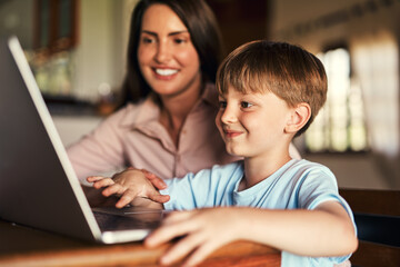 Mother, boy and laptop with help for homework, support and care for preschool, learning and growth. Woman, son and tech for educational games in home for language, math or skill for child development