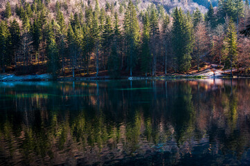 Morning in the Fusine lakes valley. Autumn reflections.