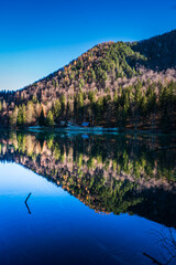 Morning in the Fusine lakes valley. Autumn reflections.