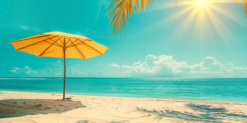 Fototapeta premium A bright and cheerful beach scene featuring a vibrant yellow umbrella set against clear blue skies, inviting a relaxing day by the seaside with golden sand and sunlight.