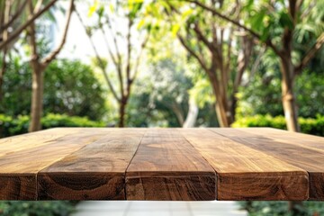 Empty top of wooden table or counter with nature background. For product display