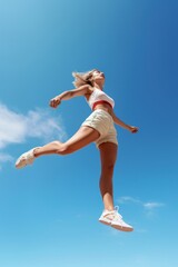 Obraz premium Female jumping sports blue.