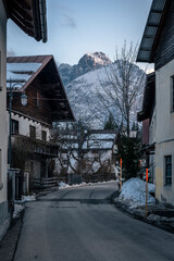 Fototapeta premium Valbruna and Val Saisera at the end of winter. Between the snow and the first flowers of the new season
