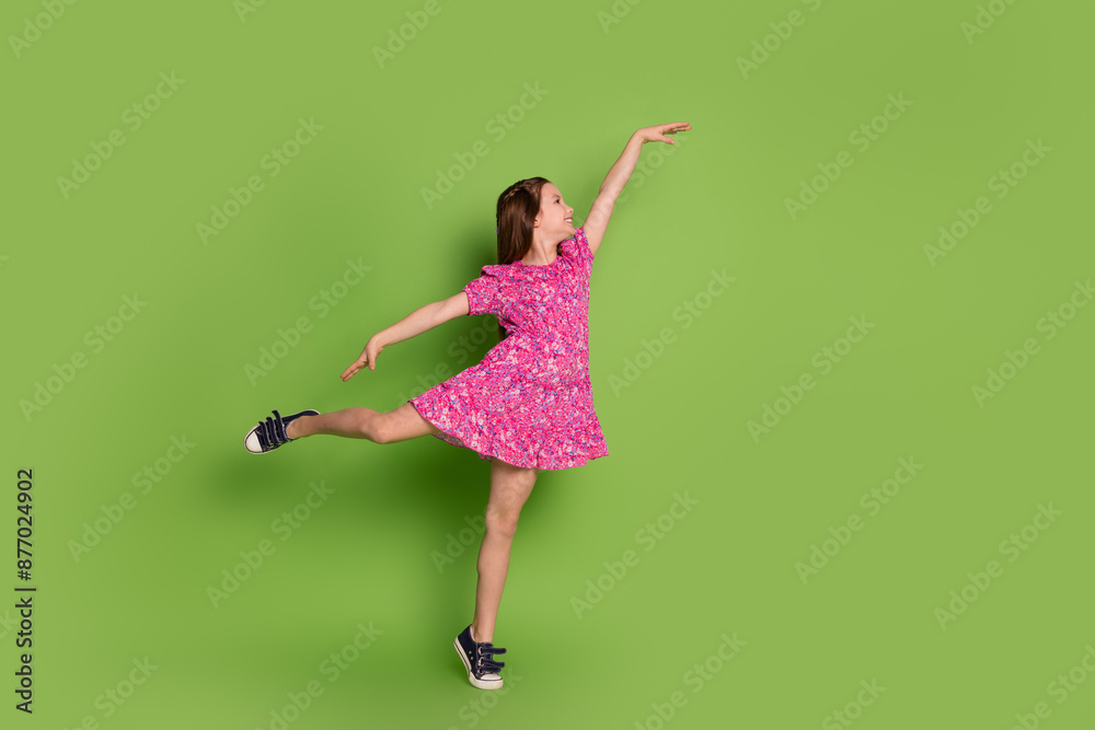 Wall mural Full body portrait of lovely schoolgirl ballet dance empty space wear pink dress isolated on green color background