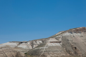 Blue sky and barren mountain landscape