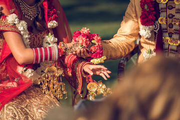 Traditional Indian wedding ceremony exchanging garlands