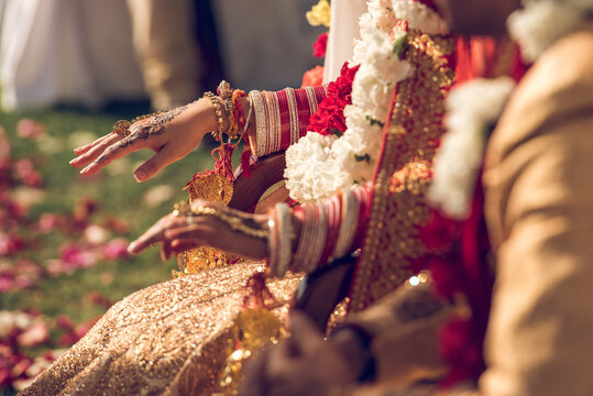 Traditional Indian unrecognizable bride prepares for her wedding ceremony