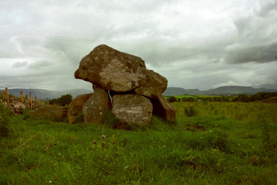 Scenic view of Carrowmore Megalithic Cemetery with meadow on a cloudy summer day. Photo taken August 1995, Carrowmoreknock, Co. Galway, Ireland.