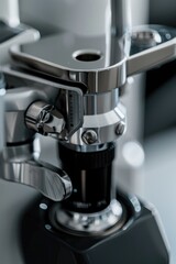 A close-up view of a microscope sitting on a table, ready for use