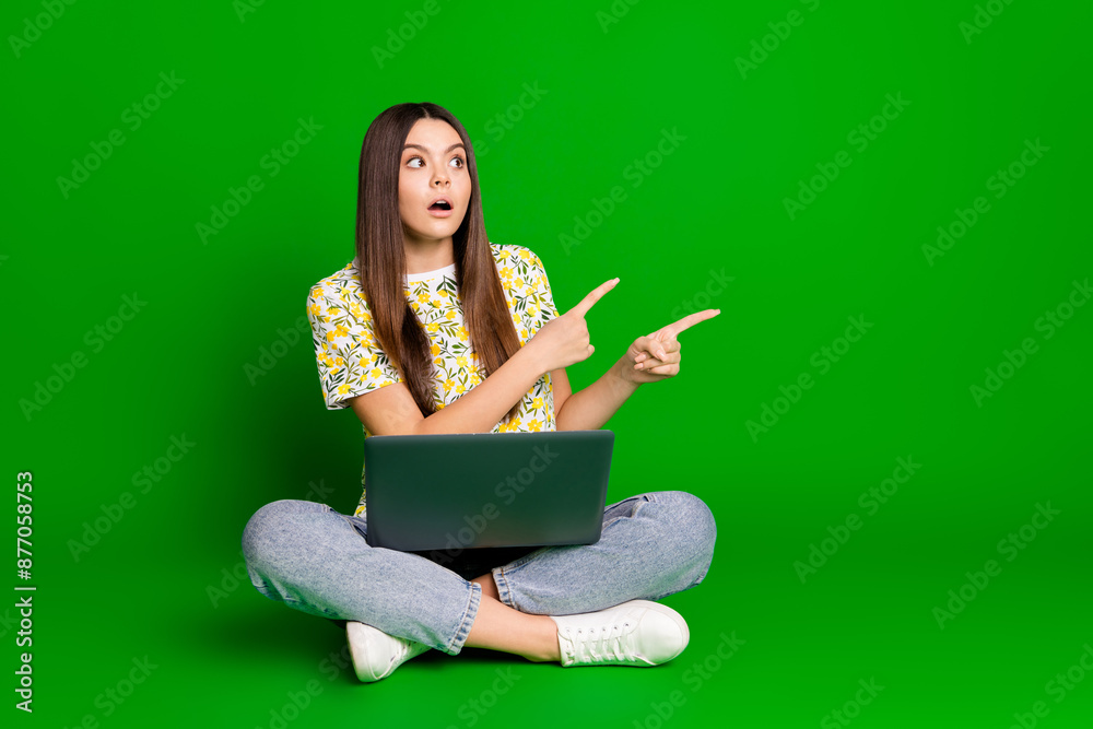 Sticker full length photo of lovely teen lady sit floor netbook point empty space dressed flowers print garm