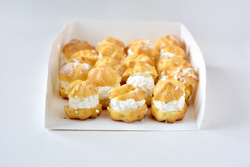 cream puff in white papaer box
