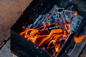 Fire, sparks and coals in the grill