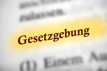 Fototapeta premium Gesetzgebung - Deutsches Text Wort mit gelber Markierung