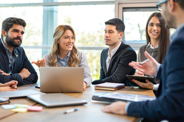 Business professionals meeting in the boardroom discussing strategies and make important decisions