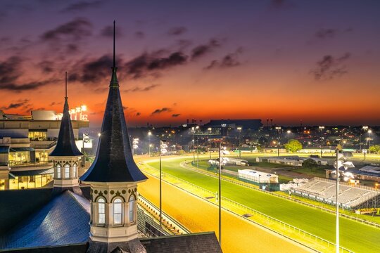 View of Churchill Downs race track in Louisville, Kentucky with a vibrant sunset sky