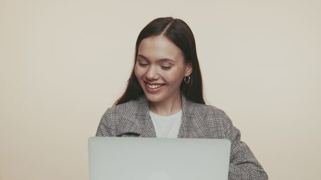 A focused professional woman engaged in work on her laptop. Perfect for business and technology themes.