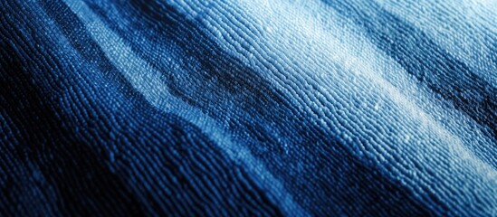 Diagonal pattern gradient indigo blue striped alpaca wool fabric with copy space image.