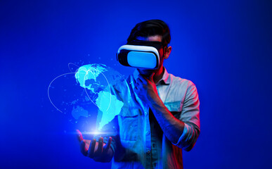 Smart man using VR goggle to connect global network connection. Happy man with casual cloth access...