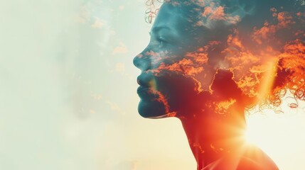 Double exposure photo of a woman's face with sky and clouds behind her.