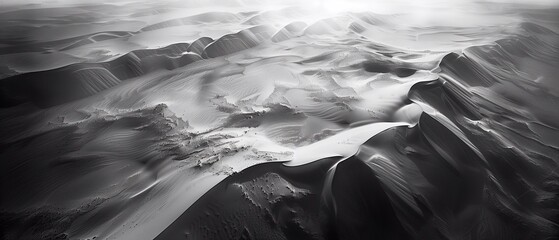 The rolling sand dunes, sculpted by the wind, create a mesmerizing pattern of light and shadow, The image evokes a sense of awe and wonder at the power and majesty of nature.