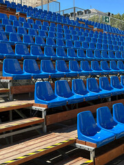 Bleechers in a row next to a sport field