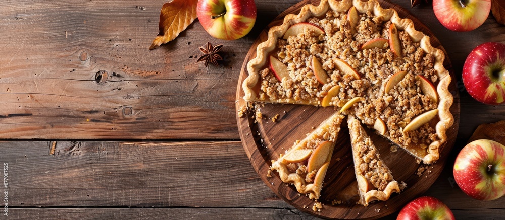 Aufkleber Top view of apple crumble pie slices on a wooden board with ample copy space image.