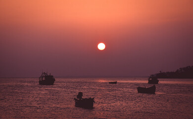 early morning sunrise or sunset over the sea, ocean. Golden hour photo can be used as background, wallpaper