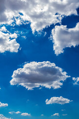 Beautiful blue sky with clouds. Space for advertising. Vertical.