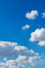 Beautiful blue sky with clouds. Space for advertising. Vertical.