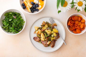 Stewed duck fillet with potatoes and asparagus and radishes, mixed salad of various greens, baked carrots in tahini sauce, orange and blueberry for dessert, healthy delicious breakfasts or lunches